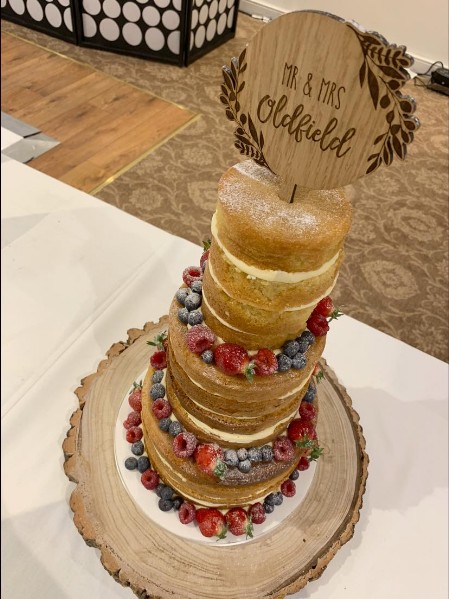 3 tier naked wedding cake with fresh fruit